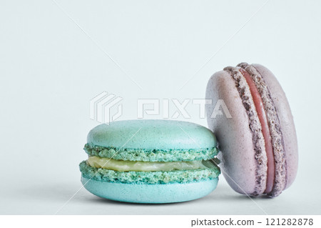 Two colorful French Macarons, macaroons cakes with different flavors Two colorful French Macarons, macaroons cakes with different flavors 121282878