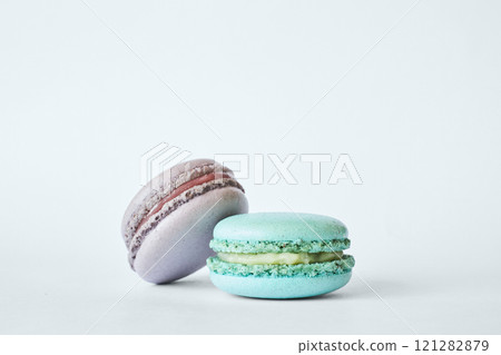 Two colorful French Macarons, macaroons cakes with different flavors Two colorful French Macarons, macaroons cakes with different flavors 121282879