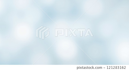 Soft focus winter background with gentle snowfall on light blue sky perfect for holiday season Soft focus winter background with gentle snowfall on light blue sky perfect for holiday season 121283162