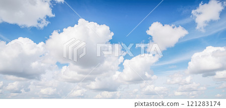 Bright blue sky texture with fluffy white clouds, perfect for nature backgrounds, weather themes, and peaceful scene Bright blue sky texture with fluffy white clouds, perfect for nature backgrounds, weather themes, and peaceful scene 121283174