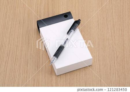 Ballpoint pen and notepad Ballpoint pen and notepad 121283450