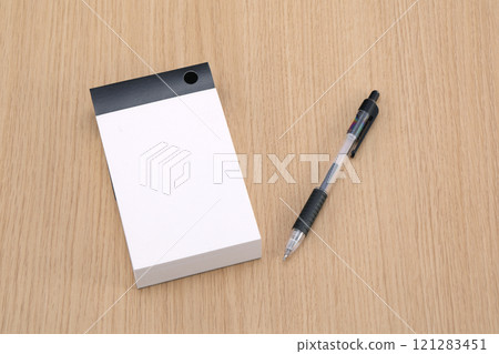 Ballpoint pen and notepad 121283451