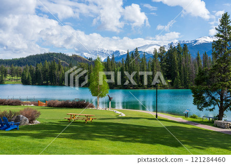 Jasper National Park summer landscape, Alberta, Canada. Lakeside of Beauvert Lake, Lac Beauvert Trail. Jasper Park Lodge. Jasper National Park summer landscape, Alberta, Canada. Lakeside of Beauvert Lake, Lac Beauvert Trail. Jasper Park Lodge. 121284460