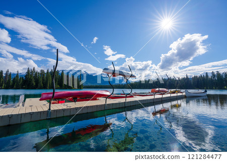 Canoe racks on dock at Beauvert Lake (Lac Beauvert). Jasper National Park summer landscape. Alberta, Canada. 121284477