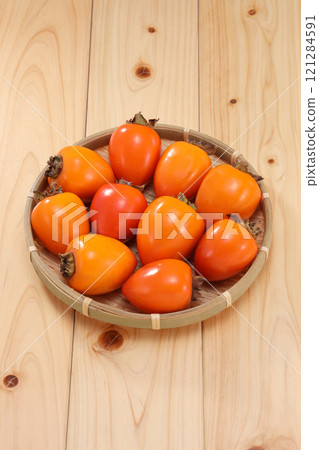 Delicious looking persimmon 121284591