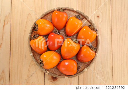 Delicious looking persimmon 121284592