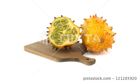 Ripe kiwano melon, also known as spiked melon cut to reveal its unique interior isolated on white 121285920