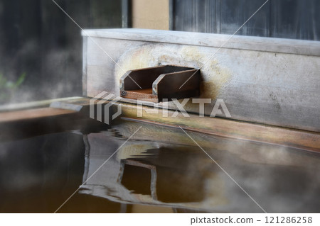 Steam rising from the open-air cypress bath and reflected on the water's surface create a fantastic scene. Steam rising from the open-air cypress bath and reflected on the water's surface create a fantastic scene. 121286258
