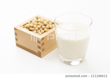 Soy milk and soybeans on white background 121286612