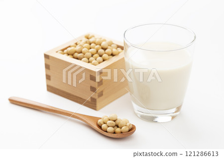 Soy milk and soybeans on white background 121286613