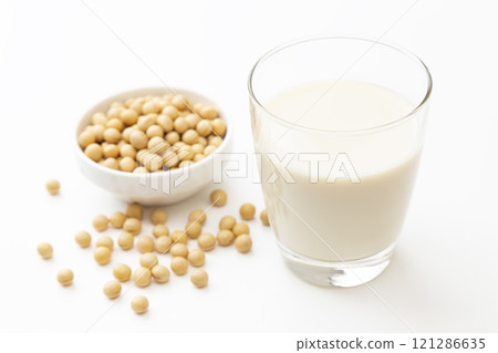 Soy milk and soybeans on white background 121286635