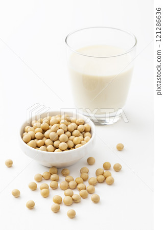 Soy milk and soybeans on white background Soy milk and soybeans on white background 121286636