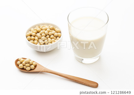 Soy milk and soybeans on white background 121286649