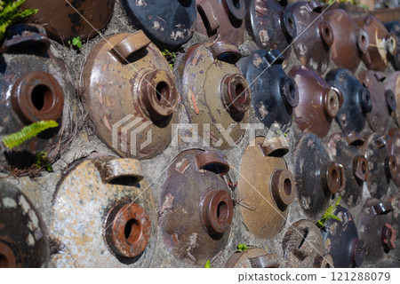 A beautiful wall with old pottery embedded in it A beautiful wall with old pottery embedded in it 121288079