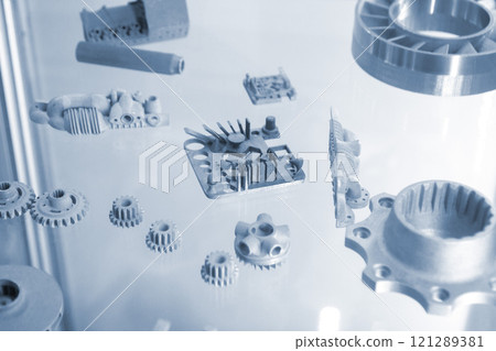 Objects printed on 3D printer from metal powder using Metal Jet technology. High detailed detailing parts. Metal Jet. 3D-printed metal parts. Modern 3D printing, additive manufacturing technologies 121289381