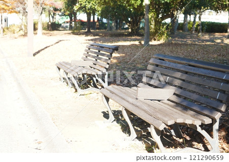 A landscape with a bench 121290659