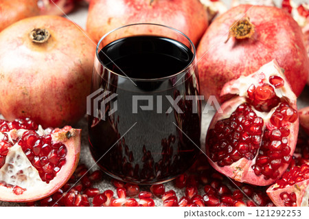 Natural pomegranate juice in a glass, close-up. 121292253