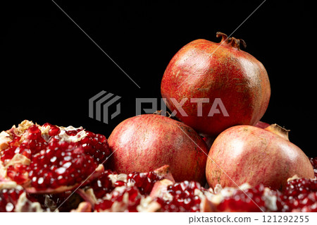 Ripe pomegranates, peeled and whole, the concept of benefits and vitamins in fruit. 121292255