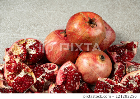 Ripe pomegranates, peeled and whole, the concept of benefits and vitamins in fruit. Ripe pomegranates, peeled and whole, the concept of benefits and vitamins in fruit. 121292256