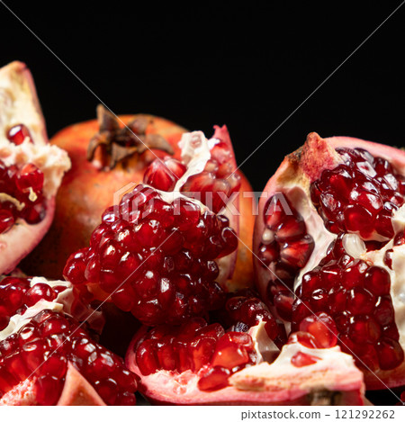 Ripe pomegranates, peeled and whole, the concept of benefits and vitamins in fruit. Ripe pomegranates, peeled and whole, the concept of benefits and vitamins in fruit. 121292262