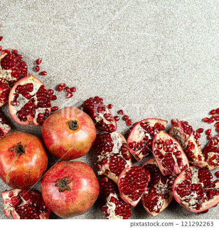 Ripe pomegranates, peeled and whole, place for text Ripe pomegranates, peeled and whole, place for text 121292263