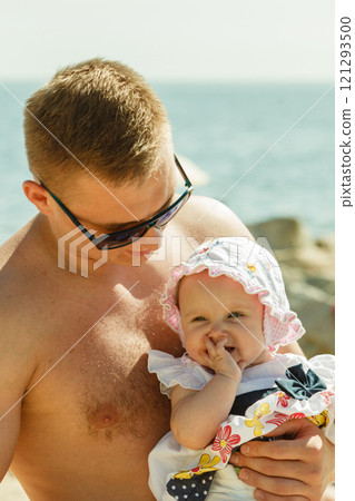 Man posing with baby on summer Man posing with baby on summer 121293500