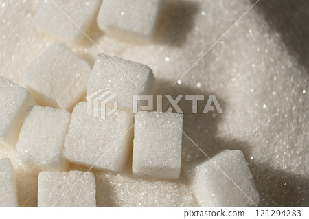 White refined beet sugar in the form of crystals and cubes. White refined beet sugar in the form of crystals and cubes. 121294283