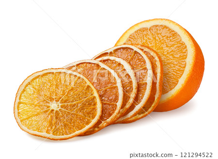 Circles of dried orange fruit and half of fresh on white background. Isolated 121294522