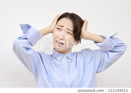 A woman holding her head White background 121294913