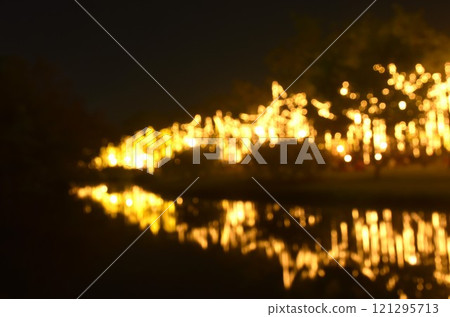 blurry light of decoration light on river background and texture  121295713