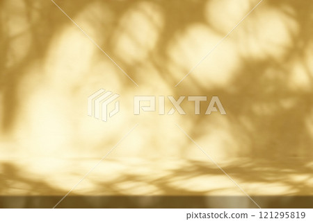 Gold Stucco Table with Christmas Leaves Shadow on Concrete Wall Texture Background Gold Stucco Table with Christmas Leaves Shadow on Concrete Wall Texture Background 121295819