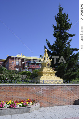 Buddhist stupa on the background of the main building of the monastery datsan Rinpoche Bagsha Buddhist stupa on the background of the main building of the monastery datsan Rinpoche Bagsha 121296429