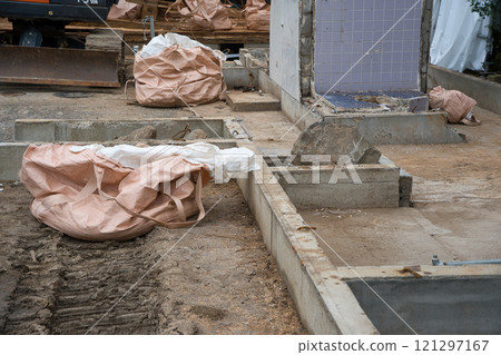 Demolition site of an old wooden house - slab foundation 121297167