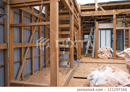 Demolition site of an old wooden house 121297168