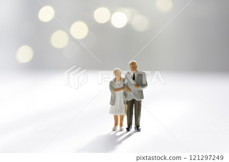 Elderly couple cuddling in the light Senior couple Elderly couple Elderly couple cuddling in the light Senior couple Elderly couple 121297249