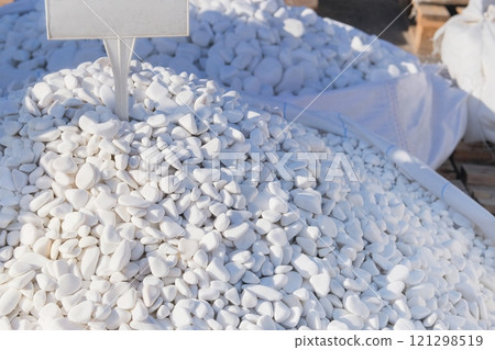 Piles of dolomite stones. Lightweight brick piles on a building project, ready for construction and decoration. Place for text. 121298519