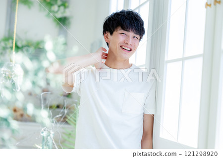 A young man with a smile 121298920