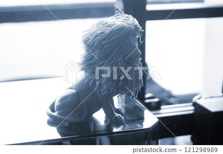Art object blue lion printed on 3D printer. Abstract small toy model blue lion created on 3d printer. FDM 3D Printing technology. Concept new 3D Printing. Additive modern new progressive technologies 121298989