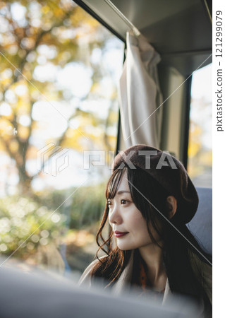 A young woman riding a bus. Photo courtesy of Ugo Kotsu. A young woman riding a bus. Photo courtesy of Ugo Kotsu. 121299079