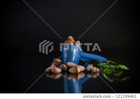 hazelnuts with nutcracker isolated on black background 121299461