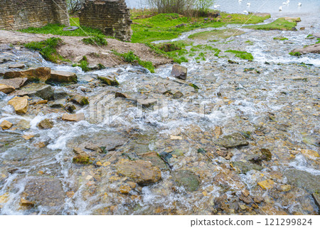 Slovenian keys or streams of the Twelve Apostles, natural and tourist object, Orthodox shrine. Russia, Pskov Region. Izborsk fortress. High quality photo Slovenian keys or streams of the Twelve Apostles, natural and tourist object, Orthodox shrine. Russia, Pskov Region. Izborsk fortress. High quality photo 121299824