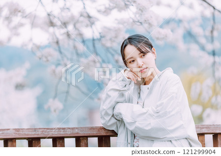 Cherry blossom and young woman 121299904