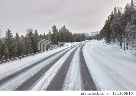Snowy road winter driving 121300610