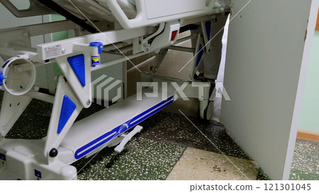 Medical orderly pushing a hospital bed into a room for surgery, highlighting healthcare importance. Surgeons aid in treatment and recovery 121301045