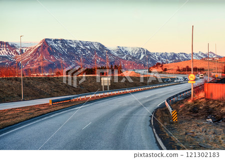 Road trip on winding road and volcanic mountain in the evening 121302183