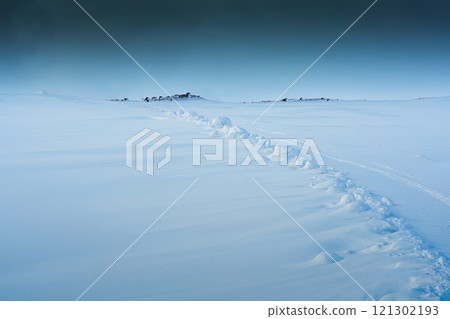 Snowy hill of summit on frozen glacier wilderness in Iceland 121302193