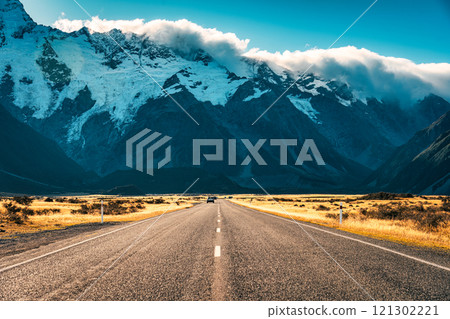 Road trip leading to Mount Cook amidst grassland in national park during autumn at New Zealand 121302221