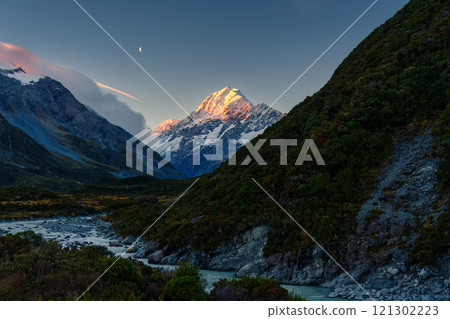 Sunset shine on Mount Cook with blue sky in Hooker Valley Track at New Zealand 121302223