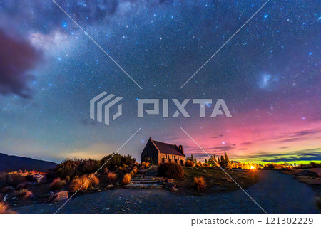 Fantastic nightscape of Church of the Good Shepherd under starry sky with Aurora Australis, Milky Way and Nebula 121302229