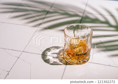 Whiskey with ice in glasses Whiskey with ice in glasses 121302272